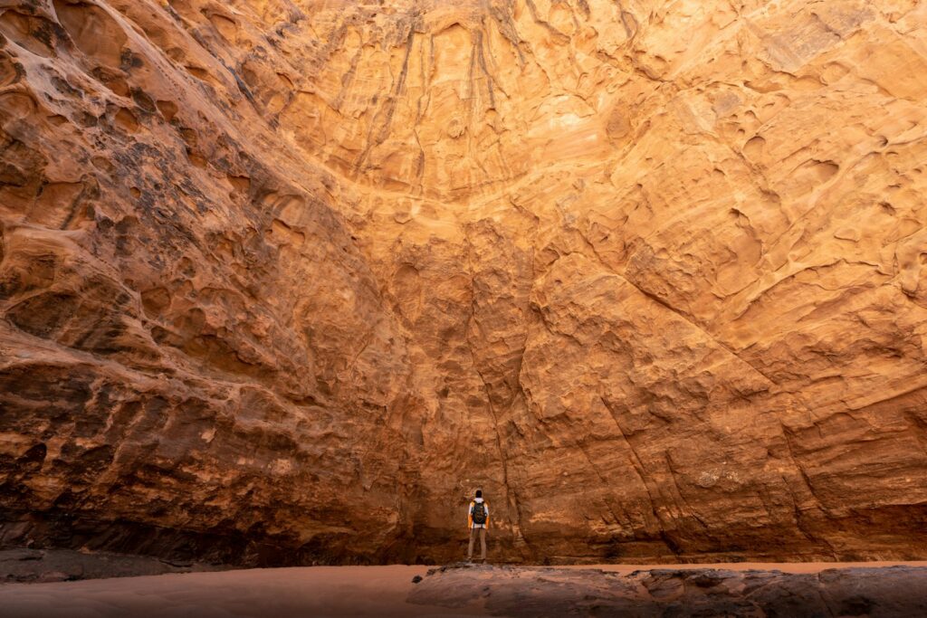 a man standing in the middle of a canyon